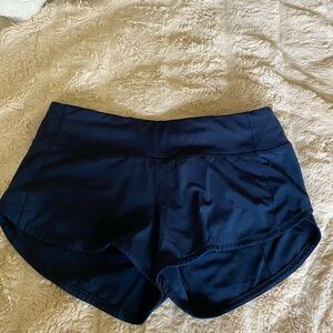 Navy blue Lululemon shorts in a size 4. Low waisted speed ups.